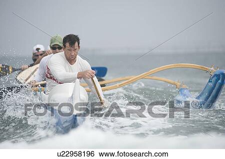 Outrigger canoeing team on water View Large Photo Image Stock Photograph - Outrigger canoeing team on water. Fotosearch