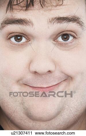 Stock Image - Overweight Man with Funny Expression, portrait, close up of face. Fotosearch