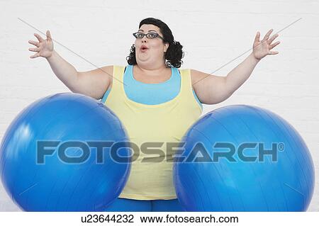 Overweight Woman dropping two Exercise Balls View Large Photo Image Stock Image - Overweight Woman dropping two Exercise Balls. Fotosearch