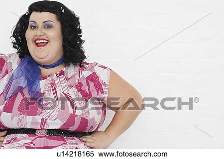 Overweight Woman posing with hands on hips, portrait View Large Photo Image Stock Photography - Overweight Woman posing with hands on hips, portrait. Fotosearch