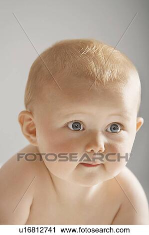 Stock Image - Pensive baby girl. Fotosearch