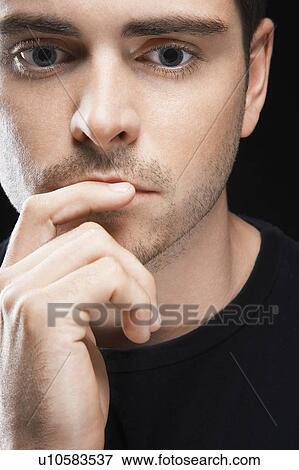 Stock Photo - Pensive Young Man. Fotosearch