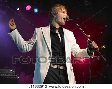 Stock Image - Pop Singer Performing on Stage. Fotosearch