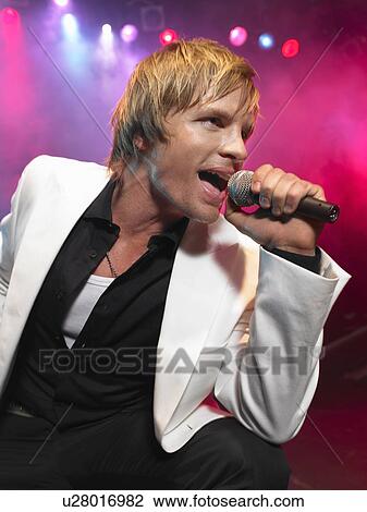 Stock Image - Pop Singer Performing on Stage. Fotosearch