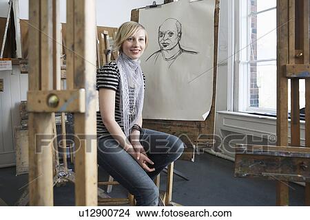 Picture - Portrait of smiling female art student in art studio. Fotosearch