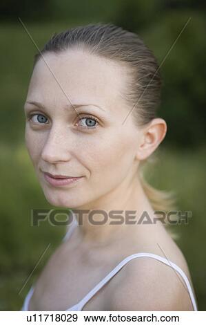 Portrait of smiling young woman View Large Photo Image Stock Photo - Portrait of smiling young woman. Fotosearch