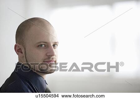 Portrait of young businessman, smiling View Large Photo Image Picture - Portrait of young businessman, smiling. Fotosearch