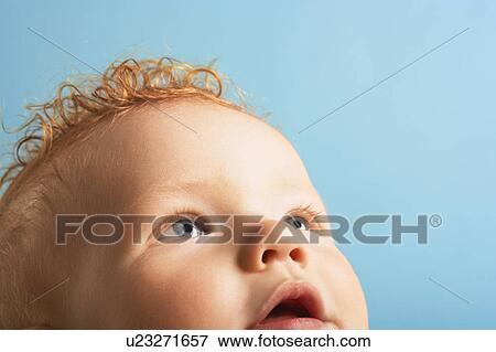 Redheaded baby looking up View Large Photo Image Stock Photo - Redheaded baby looking up. Fotosearch