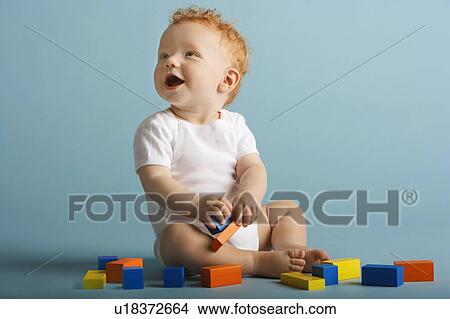 Redheaded Baby Playing With Blocks View Large Photo Image Picture - Redheaded Baby Playing With Blocks. Fotosearch
