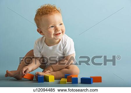 Redheaded Baby Playing With Blocks View Large Photo Image Stock Photography - Redheaded Baby Playing With Blocks. Fotosearch