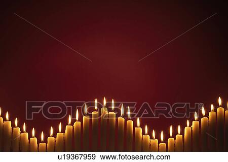 Row of lit candles, on black background View Large Photo Image Stock Photo - Row of lit candles, on black background. Fotosearch