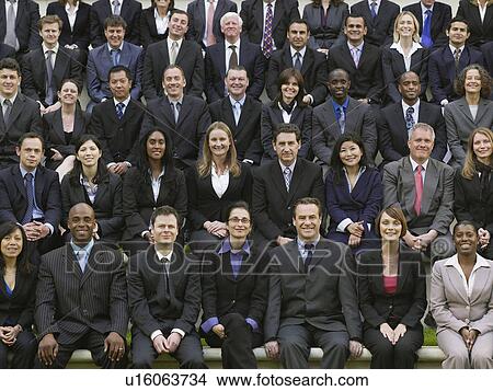 Rows of business people sitting in bleachers, portrait View Large Photo Image Picture - Rows of business people sitting in bleachers, portrait. Fotosearch