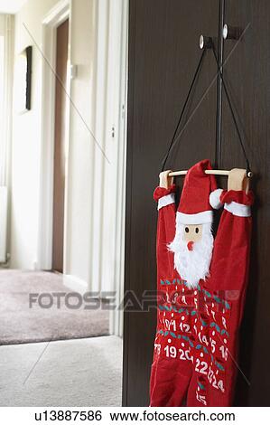 Santa clause calendar hanging on wardrobe View Large Photo Image Stock Photograph - Santa clause calendar hanging on wardrobe. Fotosearch