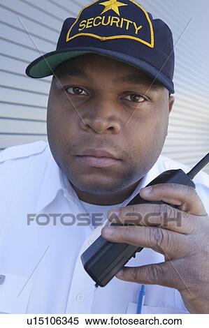 Security guard with walky talk View Large Photo Image Stock Photography - Security guard with walky talk. Fotosearch