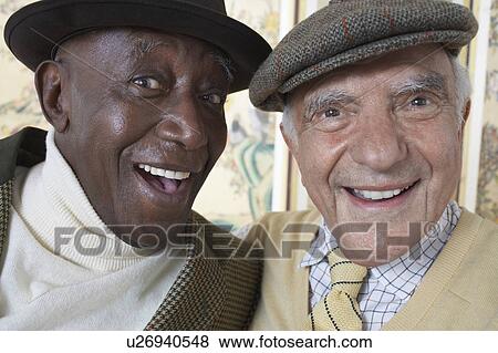 Stock Photo - Senior adult men smiling, head and shoulders. Fotosearch