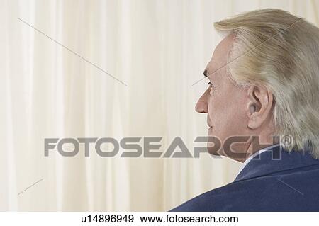 Senior Man in front of white curtain, head and shoulders, profile View Large Photo Image Stock Photo - Senior Man in front of white curtain, head and shoulders, profile. Fotosearch