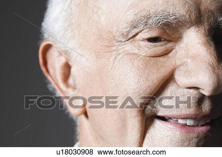 Senior man in studio, close up View Large Photo Image Stock Photo - Senior man in studio, close up. Fotosearch