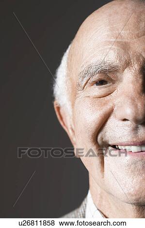 Stock Photo - Senior man in studio, close up. Fotosearch