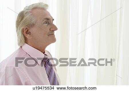 Senior Man in studio, head and shoulders, profile View Large Photo Image Picture - Senior Man in studio, head and shoulders, profile. Fotosearch