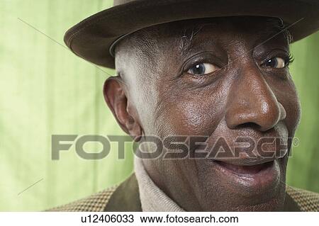 Senior Man smiling in studio, close up View Large Photo Image Stock Image - Senior Man smiling in studio, close up. Fotosearch
