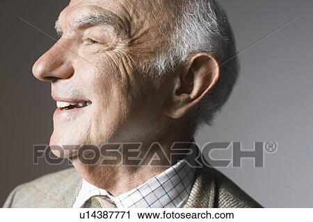 Senior man smiling in studio, close up View Large Photo Image Stock Image - Senior man smiling in studio, close up. Fotosearch