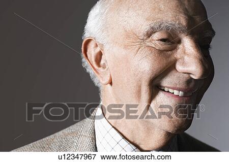Senior man smiling in studio, close up View Large Photo Image Stock Photo - Senior man smiling in studio, close up. Fotosearch