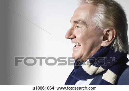 Picture - Senior Man Wearing a Scarf, head and shoulders, in studio. Fotosearch