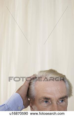 Senior Man with hand in hair, high section View Large Photo Image Stock Image - Senior Man with hand in hair, high section. Fotosearch