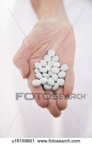 Senior woman holding out hand full of pills, close-up on hand View Large Photo Image Stock Image - Senior woman holding out hand full of pills, close-up on hand. Fotosearch