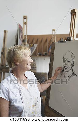 Senior woman in art class View Large Photo Image Stock Image - Senior woman in art class. Fotosearch