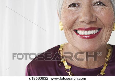 Senior woman in studio, head and shoulders, cropped View Large Photo Image Stock Image - Senior woman in studio, head and shoulders, cropped. Fotosearch
