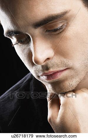 Stock Photo - Serious Young Man. Fotosearch