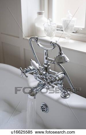 Shower fitting with running tap, London View Large Photo Image Stock Photography - Shower fitting with running tap, London. Fotosearch