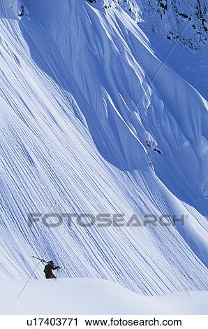 Skier on mountain slope, elevated view View Large Photo Image Stock Image - Skier on mountain slope, elevated view. Fotosearch