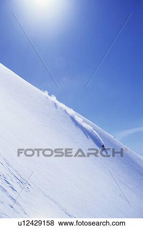 Skier on steep mountain slope View Large Photo Image Stock Photo - Skier on steep mountain slope. Fotosearch