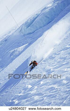 Skier on steep slope, elevated view View Large Photo Image Stock Photo - Skier on steep slope, elevated view. Fotosearch