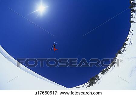 Skier performing flip on mountain View Large Photo Image Stock Photo - Skier performing flip on mountain. Fotosearch