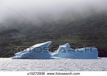 Small iceberg in front of rocks View Large Photo Image Stock Photograph - Small iceberg in front of rocks. Fotosearch