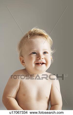 Picture - Smiling baby boy. Fotosearch