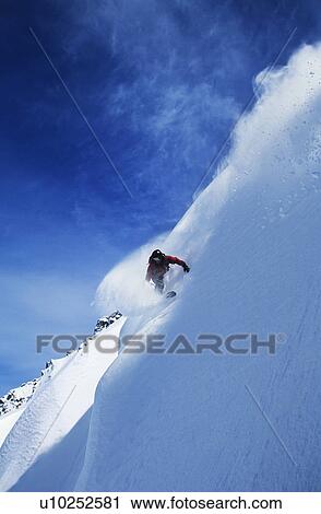 Snowboarder on steep slope View Large Photo Image Stock Image - Snowboarder on steep slope. Fotosearch