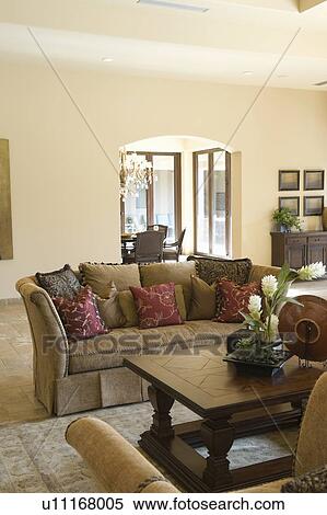 Stock Photography - Sofa with cushions and wooden coffee table. Fotosearch