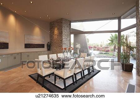 Spacious dining room and kitchen with floor to ceiling windows View Large Photo Image Stock Photography - Spacious dining room and kitchen with floor to ceiling windows. Fotosearch