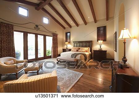 Spacious high beamed bedroom View Large Photo Image Stock Image - Spacious high beamed bedroom. Fotosearch