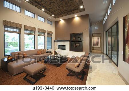 Stock Photograph - Spacious living room with double height ceiling. Fotosearch