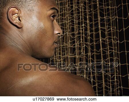 Sportsman in front of net, profile View Large Photo Image Stock Photo - Sportsman in front of net, profile. Fotosearch