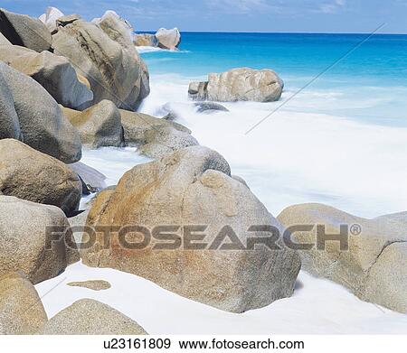 Spume along rocky coastline View Large Photo Image Stock Photo - Spume along rocky coastline. Fotosearch