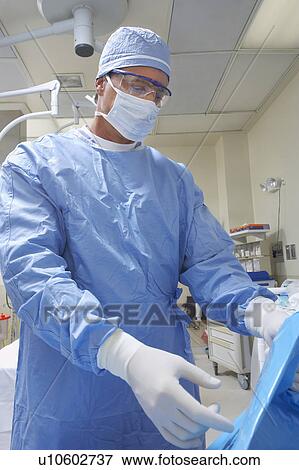 Stock Photo - Surgeon in operating room. Fotosearch