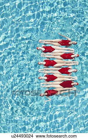 Synchronised swimmers balance head-to-toe View Large Photo Image Picture - Synchronised swimmers balance head-to-toe. Fotosearch