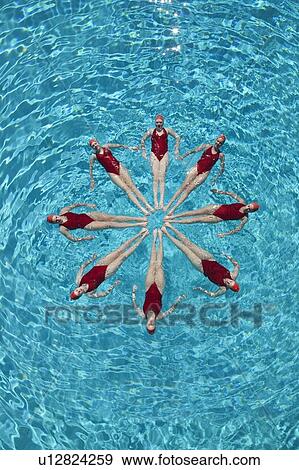 Synchronised swimmers form a star View Large Photo Image Stock Photo - Synchronised swimmers form a star. Fotosearch