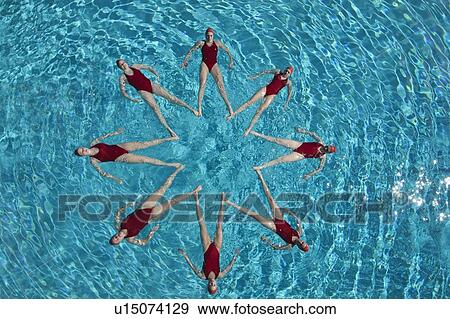 Synchronised swimmers form a star View Large Photo Image Stock Photo - Synchronised swimmers form a star. Fotosearch